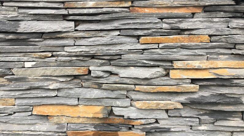 Photo How Do I Incorporate Natural Materials Like Stone and Wood into Interior Design for a Warm and Earthy Feel?
